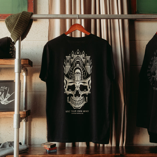 ANYWHERE'S BETTER THAN YOUR OWN MIND - BLACK UNISEX T-SHIRT